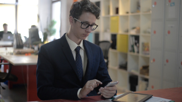 Young Man Using Smartphone