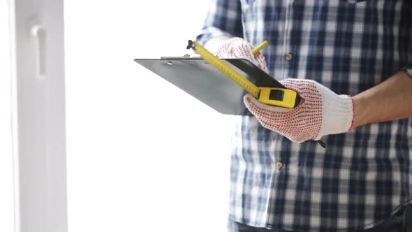 Close Up Of Man With Measuring Ruler And Clipboard 5