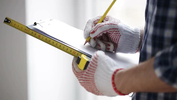 Close Up Of Man With Measuring Ruler And Clipboard 7