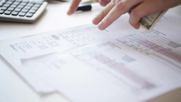 Close Up Of Male Hands With Money Checking Bills