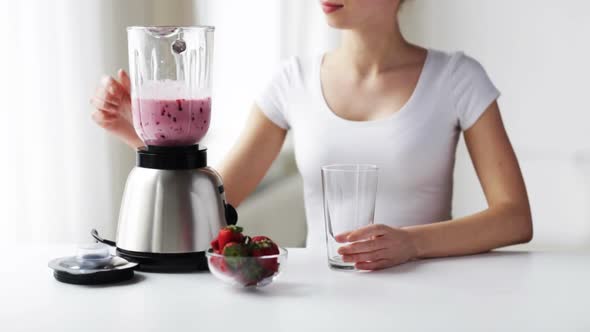 Woman With Blender Jar Pouring Milk Shake alt