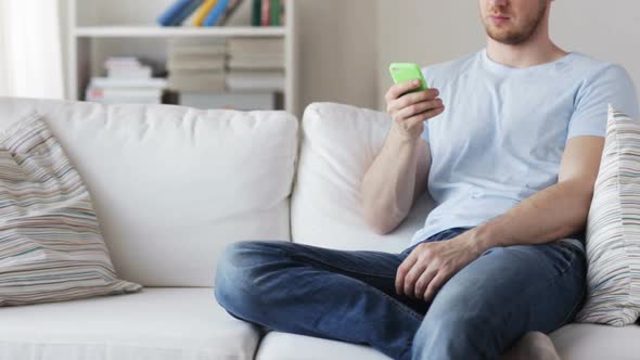 Close Up Of Man With Smartphone Texting At Home 2