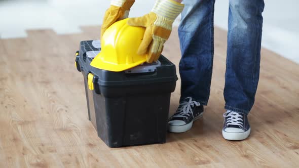 Close Up Of Man Carrying Tool Box And Leaving 1