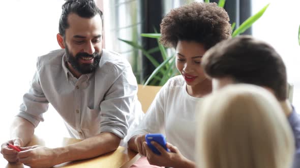 Friends With Smartphone And Tablet Pc In Office 1 alt