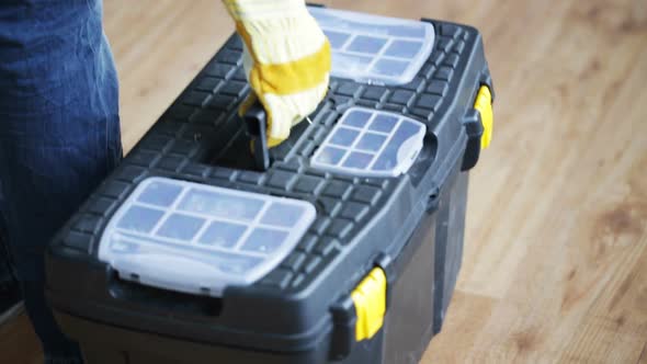 Close Up Of Man Carrying Tool Box And Leaving 5