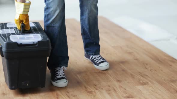 Close Up Of Man Carrying Tool Box And Leaving It 2
