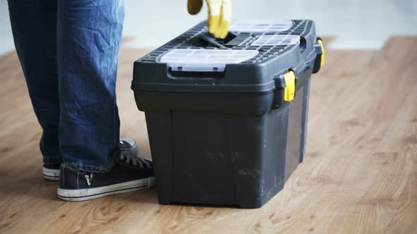 Close Up Of Man Carrying Tool Box And Leaving It 3
