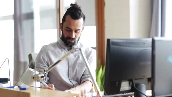 Happy Creative Male Office Worker With Computer 2