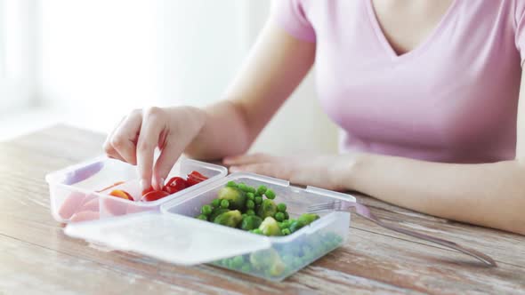 Close Up Of Woman Eating Vegetables From Container 3