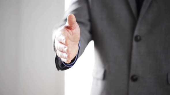 Close Up Of Businessman Giving Hand For Handshake 3 alt