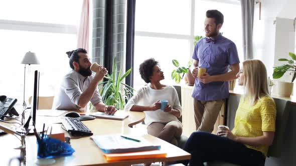 Happy Creative Team Drinking Coffee In Office 17 alt