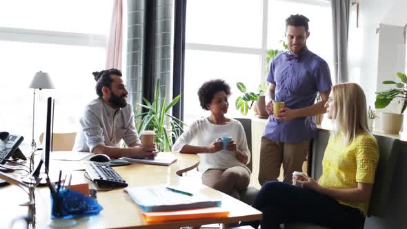 Happy Creative Team Drinking Coffee In Office 18