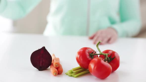 Close Up Of Woman Hands With Juice And Vegetables 1 alt