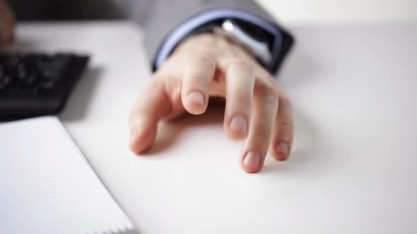 Close Up Of Businessman Hand Banging Fingers