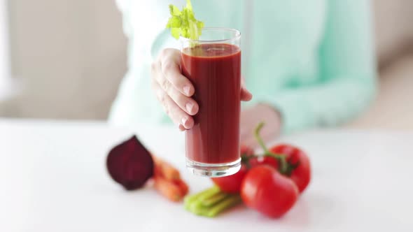 Close Up Of Woman Hands With Juice And Vegetables 2