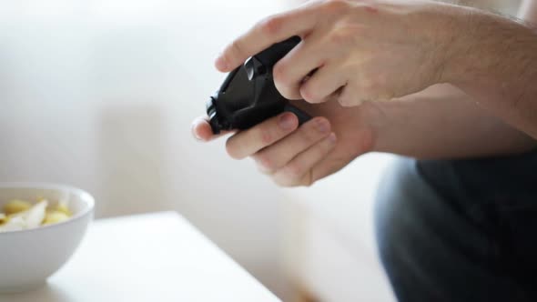 Close Up Of Man Hands Playing Video Game At Home 2