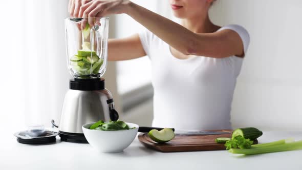 Smiling Woman With Blender And Green Vegetables 2
