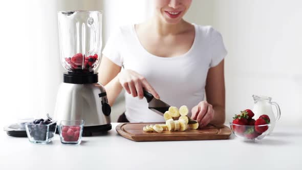 Smiling Young Woman With Blender Chopping Banana 2