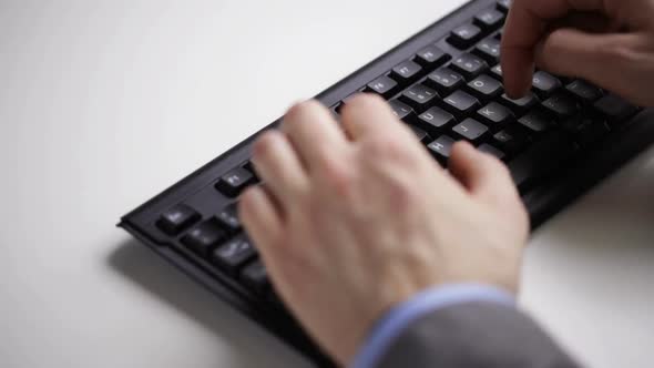 Close Up Of Businessman Hands Typing On Keyboard 23 alt