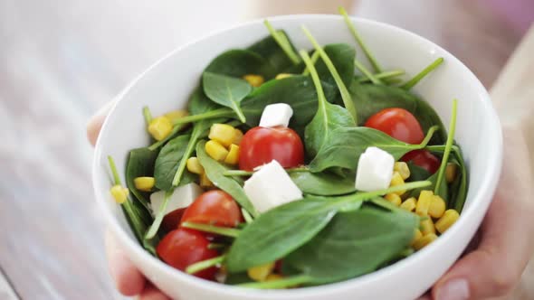 Close Up Of Young Woman Hands Showing Salad Bowl 5