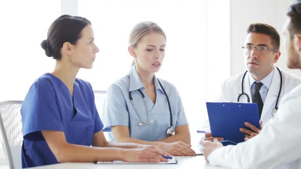 Group Of Doctors Meeting And Talking At Hospital 1 alt