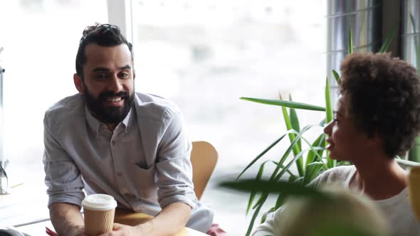 Happy Creative Team With Coffee Talking In Office 4 alt