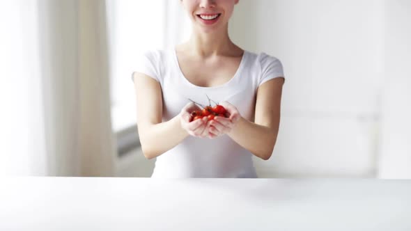 Close Up Of Young Woman Showing Cherry Tomatoes 3