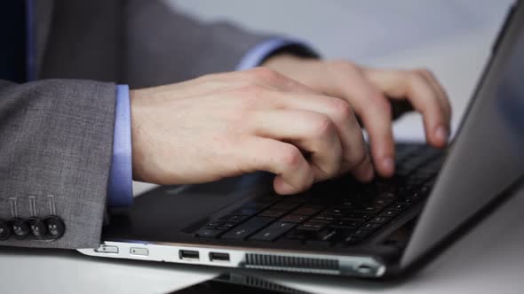 Close Up Of Businessman Hands Typing On Laptop 3