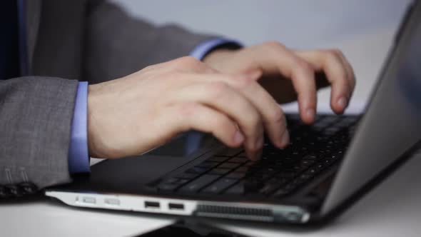 Close Up Of Businessman Hands Typing On Laptop 4