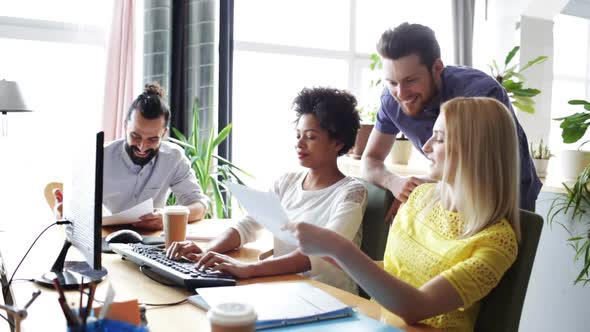 Happy Creative Team With Computers In Office 10 alt