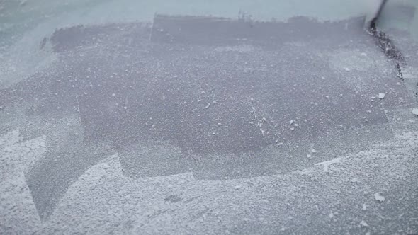 Man Scraping A Frozen Car Windshield Timelapse