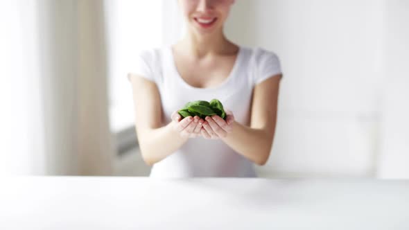 Close Up Of Young Woman Showing Spinach 2