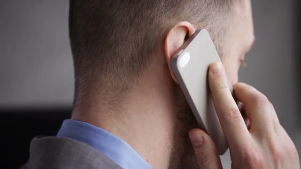 Close Up Of Businessman Head Calling On Smartphone alt