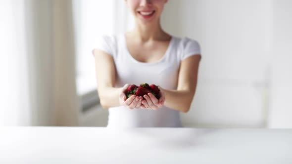 Close Up Of Young Woman Showing Strawberries 3 alt