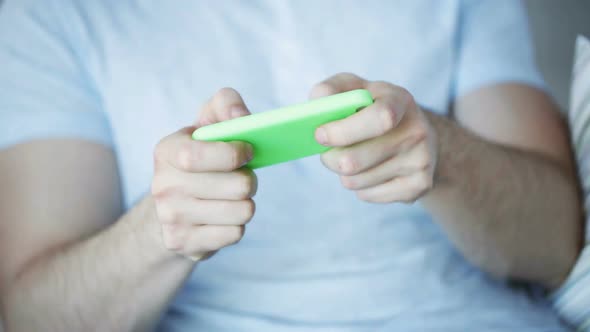 Close Up Of Man Playing Game On Smartphone At Home 5