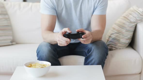 Close Up Of Man Playing Video Game At Home 1