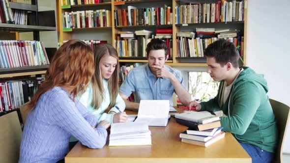 Students With Books Preparing To Exam In Library 10