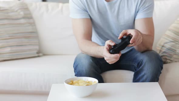Close Up Of Man Playing Video Game At Home 2 alt