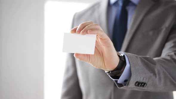 Close Up Of Businessman Showing White Blank Card 3