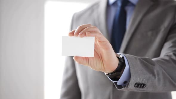Close Up Of Businessman Showing White Blank Card 5