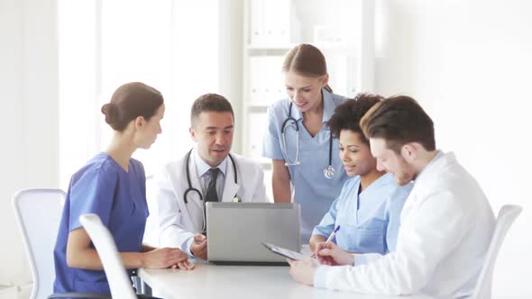 Group Of Doctors With Laptop Meeting At Hospital 1