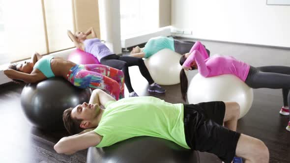 Happy People Flexing Abdominal Muscles On Fitball 3 alt
