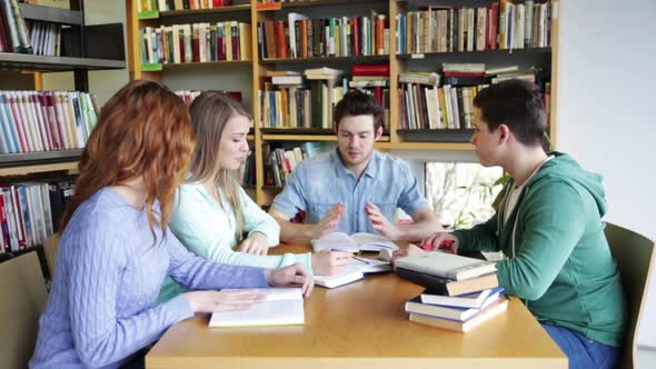 Students With Books Preparing To Exam In Library 5