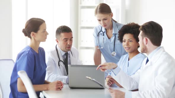 Group Of Doctors With Laptop Meeting At Hospital 5