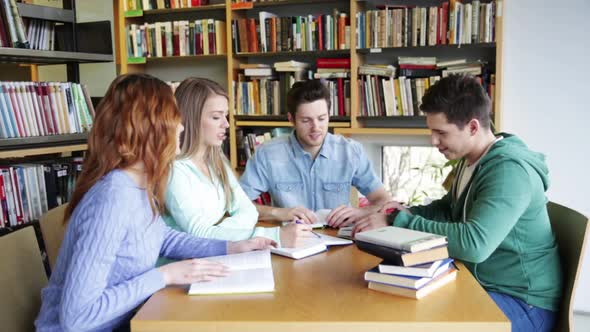 Students With Books Preparing To Exam In Library 6
