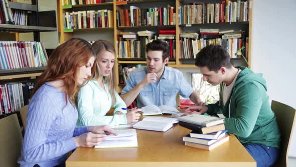 Students With Books Preparing To Exam In Library 7