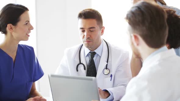 Group Of Doctors With Laptop Meeting At Hospital 7