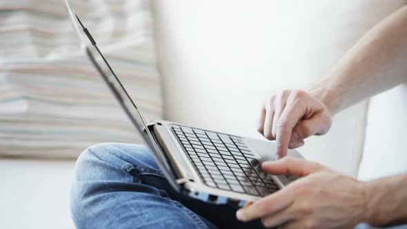 Close Up Of Man Typing On Laptop At Home 3 alt