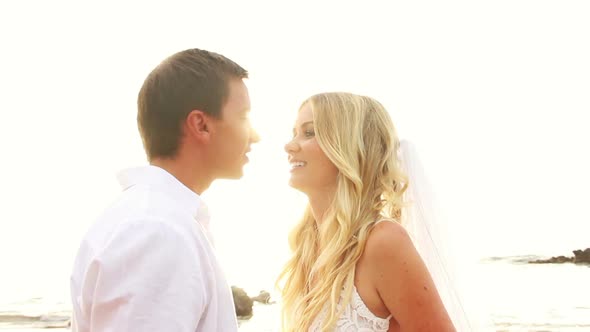 Newly Married Couple Kissing On Tropical Beach At Sunset 2