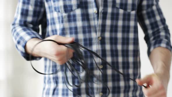 Close Up Of Man Untangling Wires 4